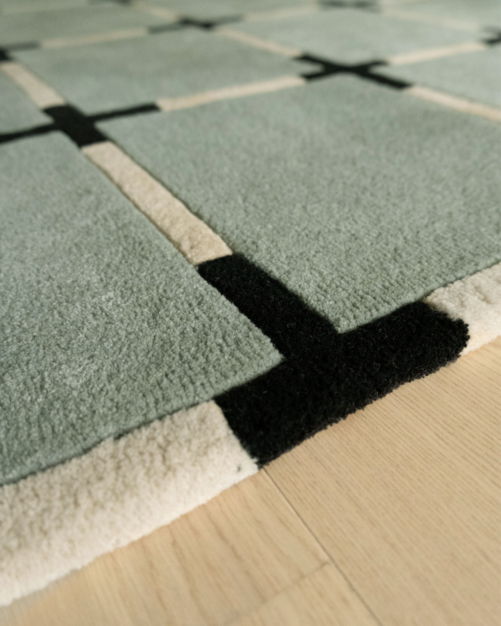 Détail du tapis de chambre Asta céladon par Camille Techer